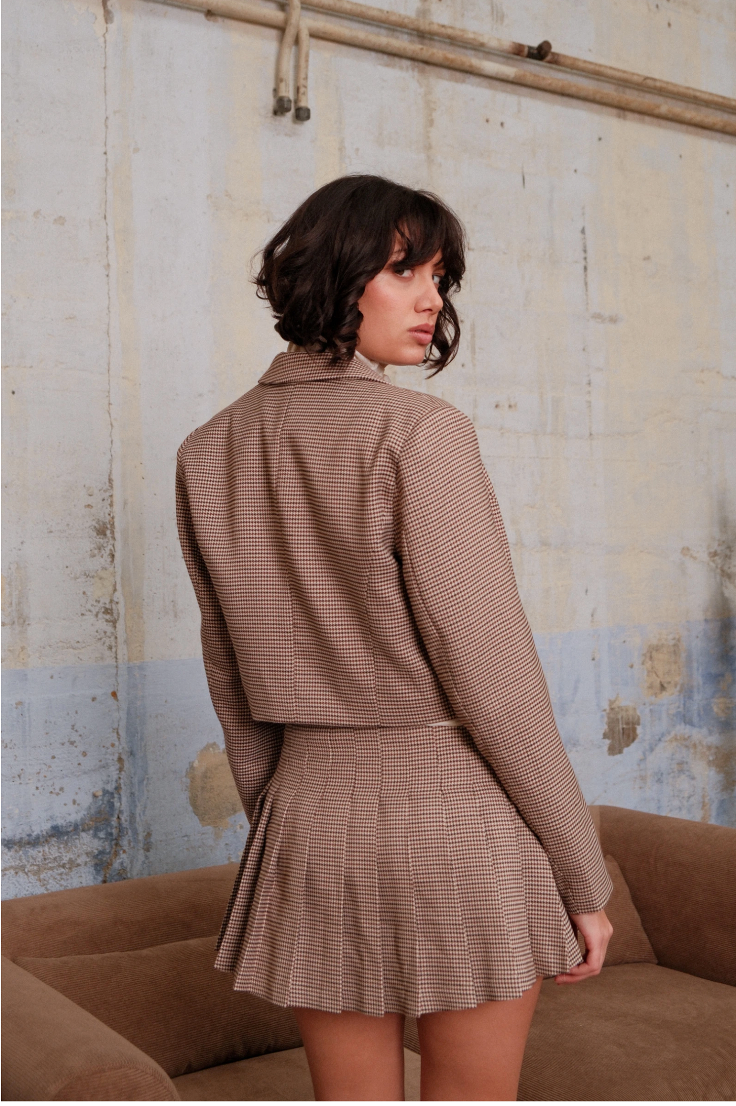 Geplooide minirok met pied-de-poule-motief en ingebouwde short