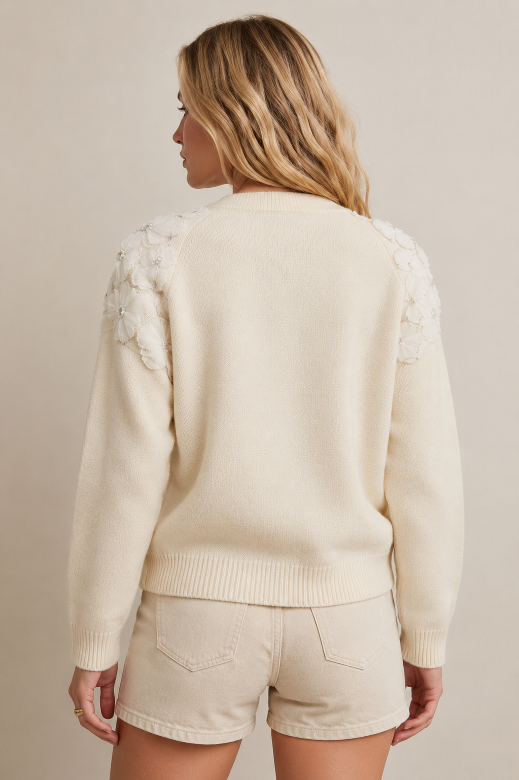 Gebreid vest met parels en pailletten